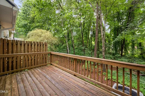 a view of balcony with wooden floor