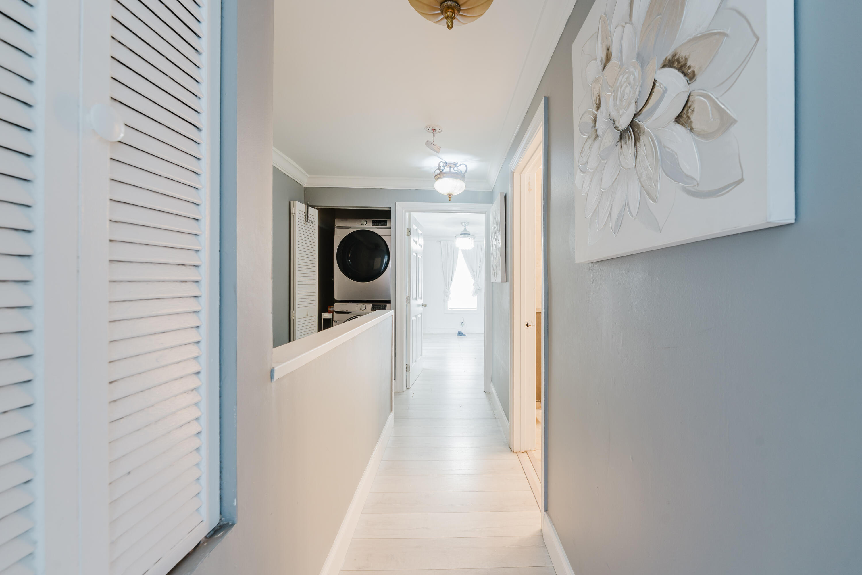 700 East Palmetto Park Road Boca Raton, FL 33432 - Photo 18 of 27 a view of a hallway with washer and dryer