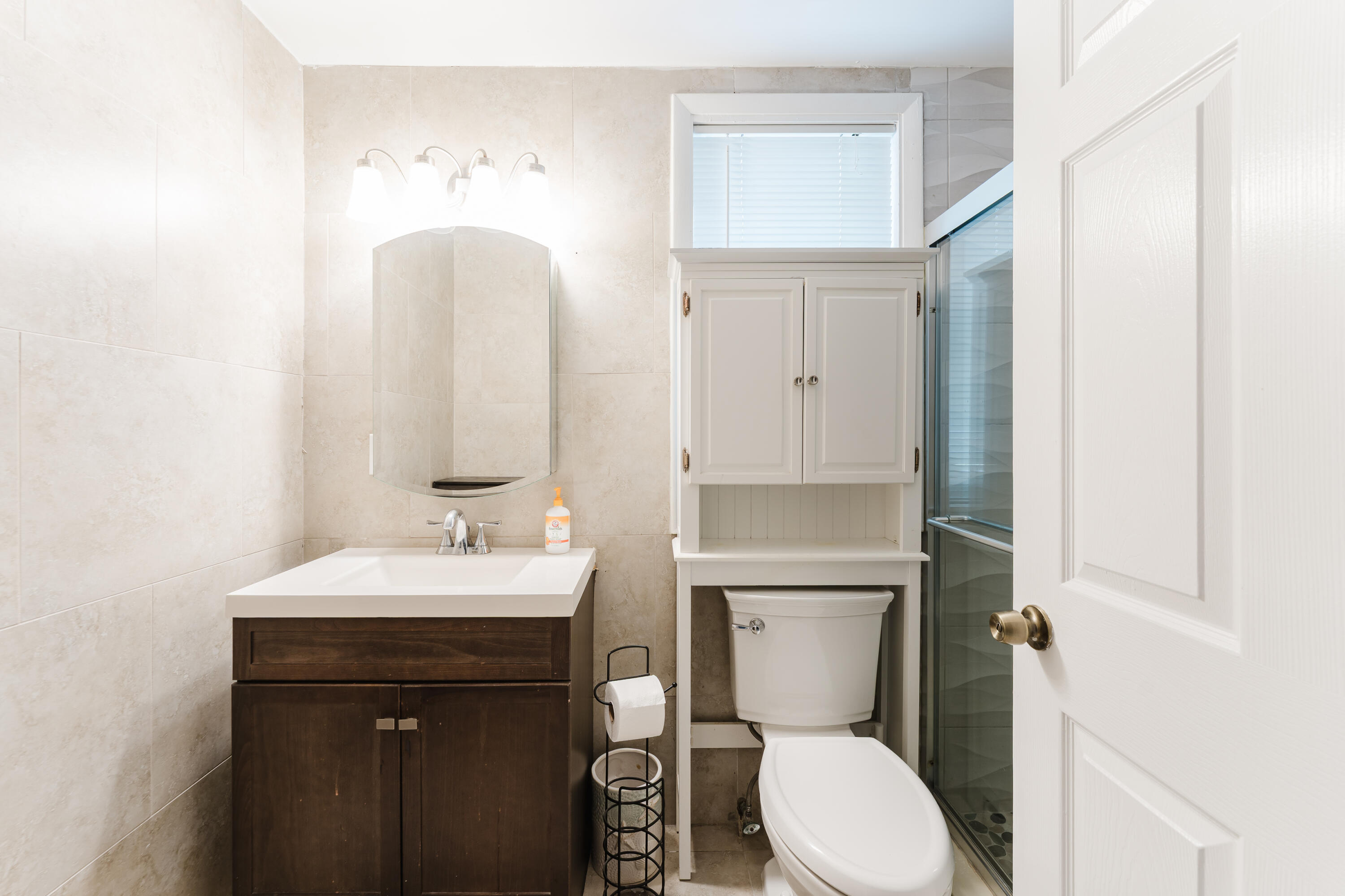 700 East Palmetto Park Road Boca Raton, FL 33432 - Photo 19 of 27 a bathroom with a toilet sink and mirror