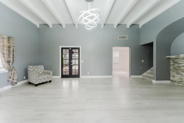 a view of an empty room with a window