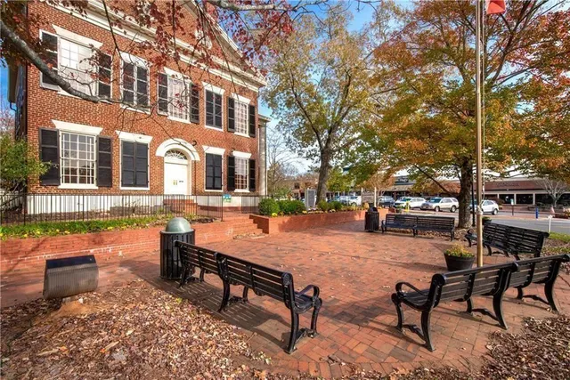 a swimming pool with outdoor seating and yard