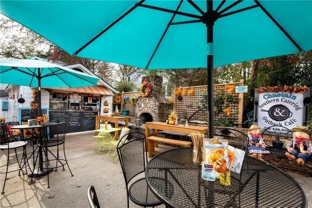 an outdoor space with furniture and umbrella
