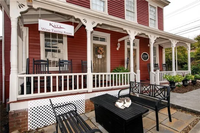 a view of a chairs and a table and chair in the balcony