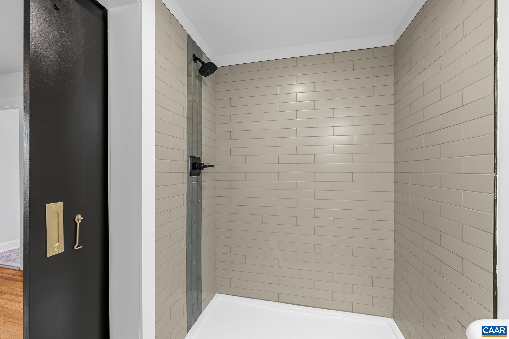 2733 Cedar Lane Road Kents Store, VA 23084 - Photo 27 of 43 This stunning primary bathroom features all-new fixtures and a beautifully tiled walk-in shower.