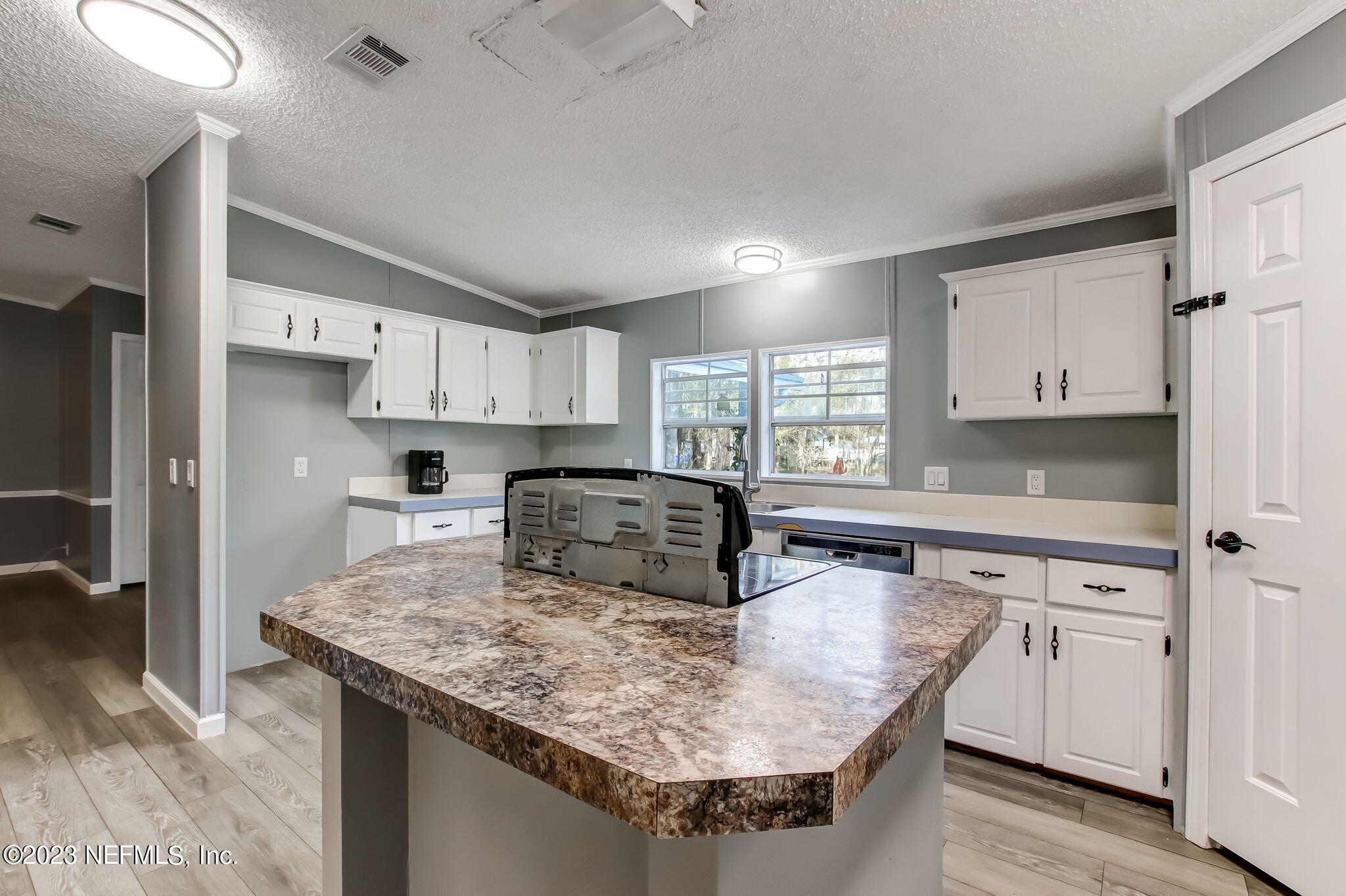 44124 Maple Court Callahan, FL 32011 - Photo 7 of 44 Kitchen Island surrounded by cabinetry