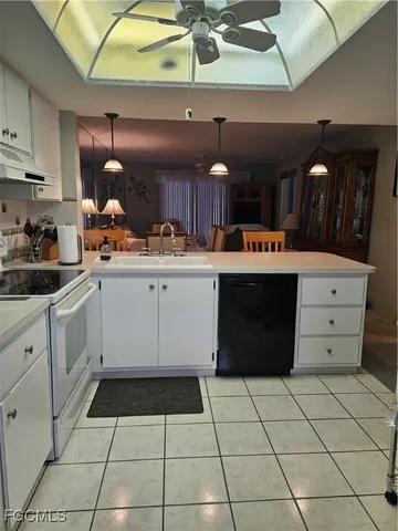 a kitchen with a cabinets and appliances
