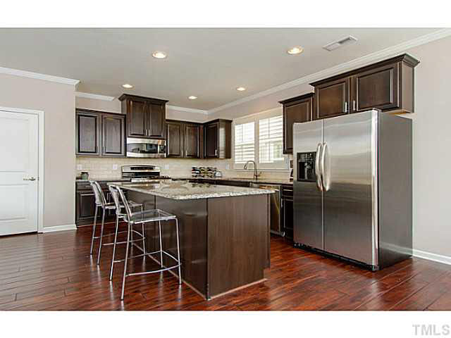 1410 Rodessa Run Raleigh, NC 27607 - Photo 11 of 25 FULL SIZED PANTRY AND UNDERCABINET LIGHTING MAKES THIS KITCHEN BEAUTIFUL AND PRACTICAL. Kitchen