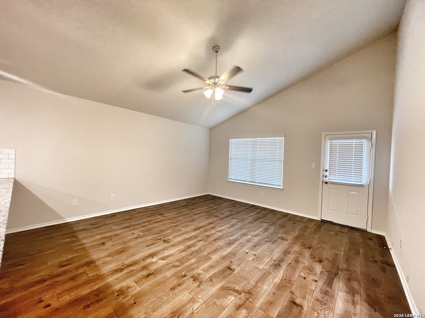 29529 Spring Copper Bulverde, TX 78163 - Photo 13 of 41 an empty room with a chandelier fan and windows