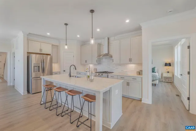 a kitchen with a sink stove and refrigerator