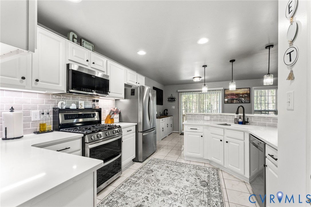 3120 Denise Road Petersburg, VA 23805 - Photo 20 of 51 Spacious kitchen featuring white cabinetry, light-