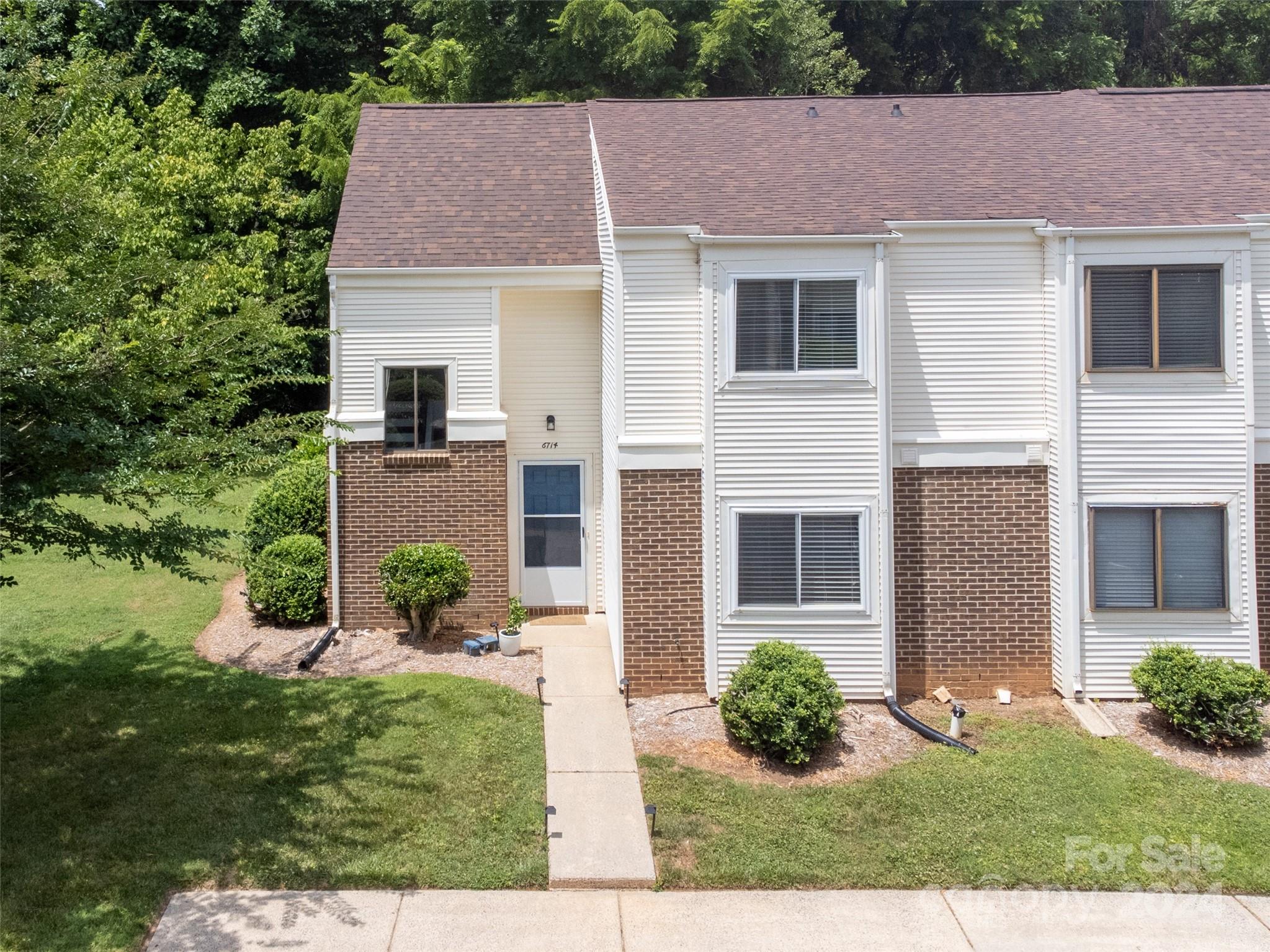 a aerial view of a house with yard