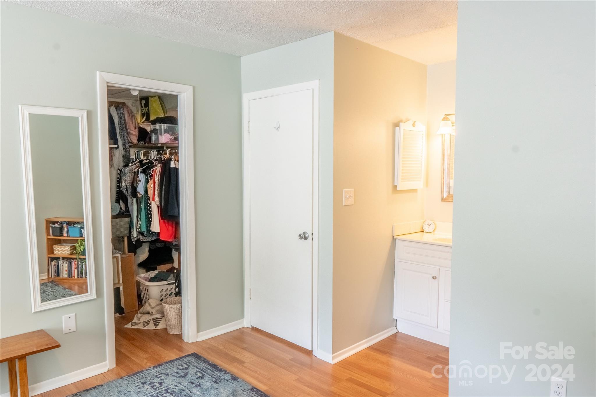6714 Thermal Road Charlotte, NC 28211 - Photo 18 of 25 a view of a bedroom with wooden floor and closet