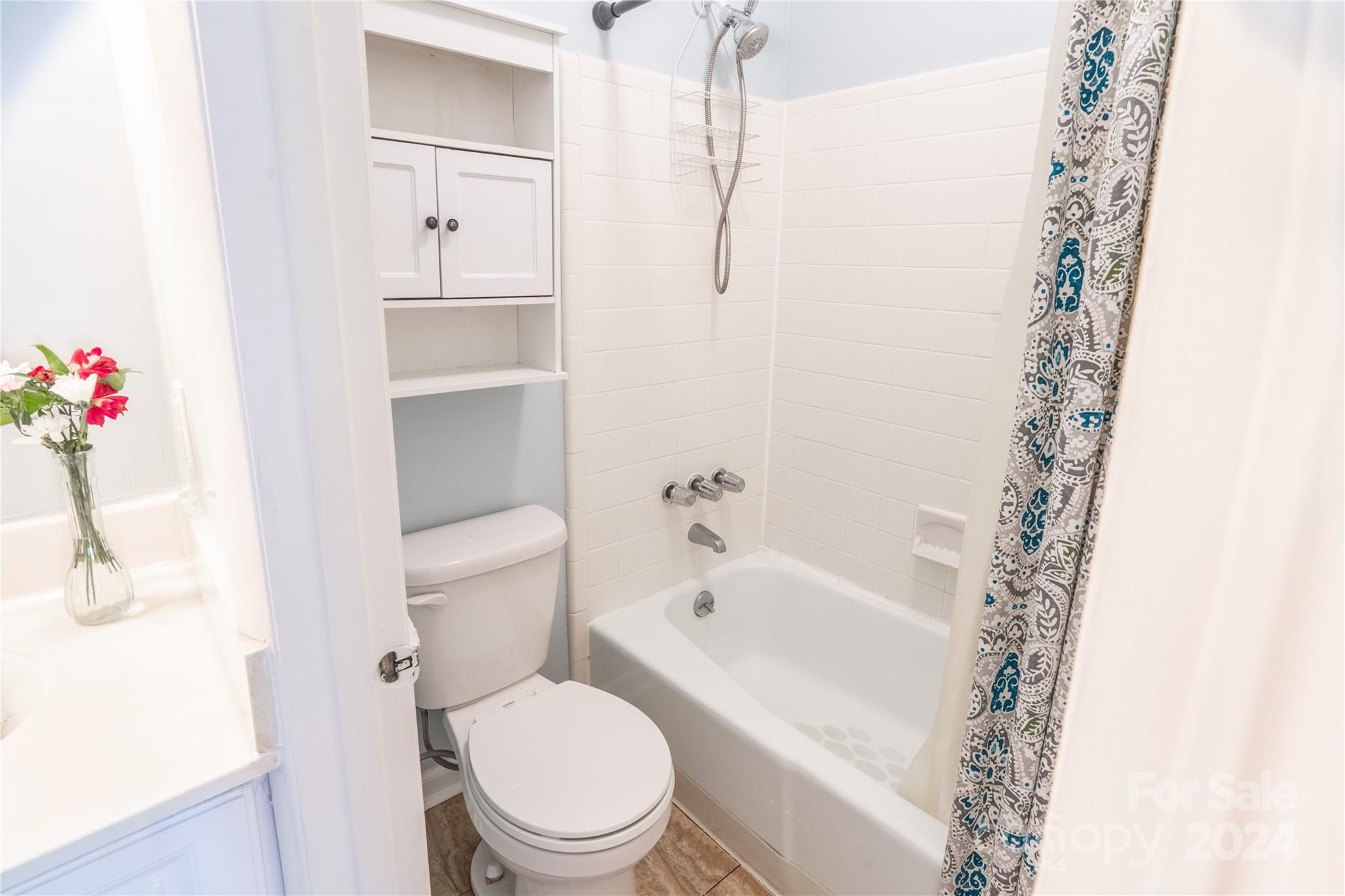 6714 Thermal Road Charlotte, NC 28211 - Photo 20 of 25 a white toilet sitting next to a bath tub