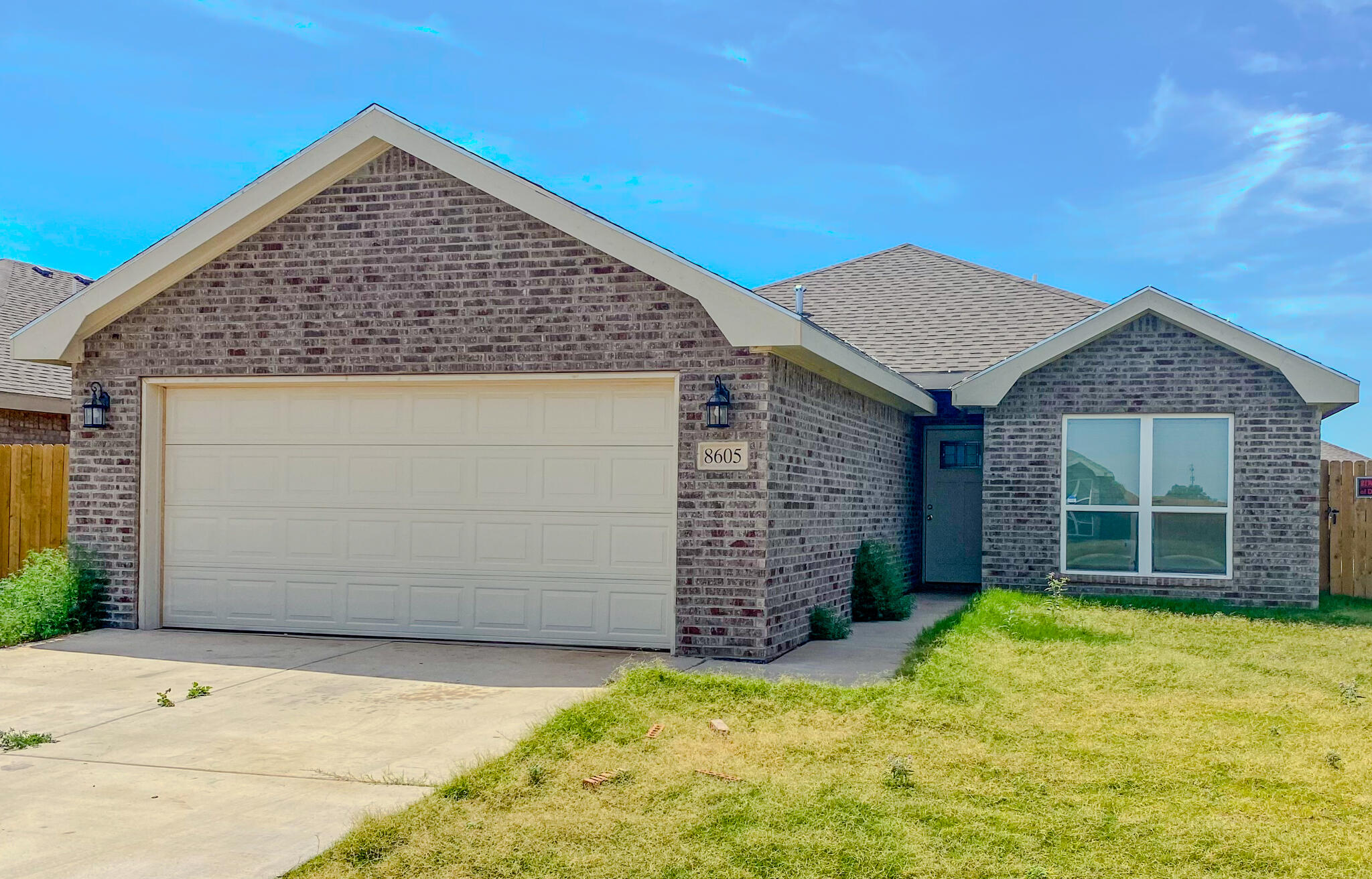 8605 10th Place Lubbock, TX 79416 - Photo 1 of 18 front view of a house with a yard
