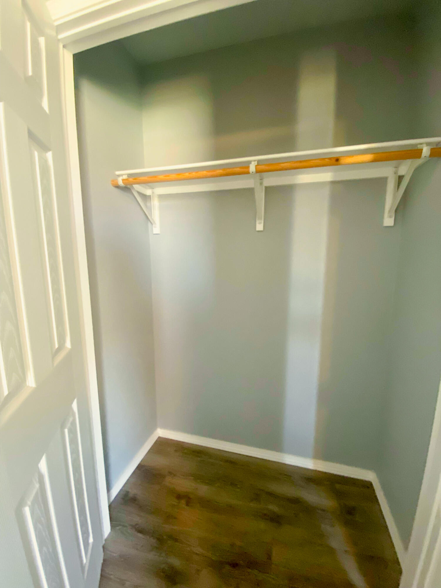 8605 10th Place Lubbock, TX 79416 - Photo 11 of 18 a view of a room with wooden floor and a window