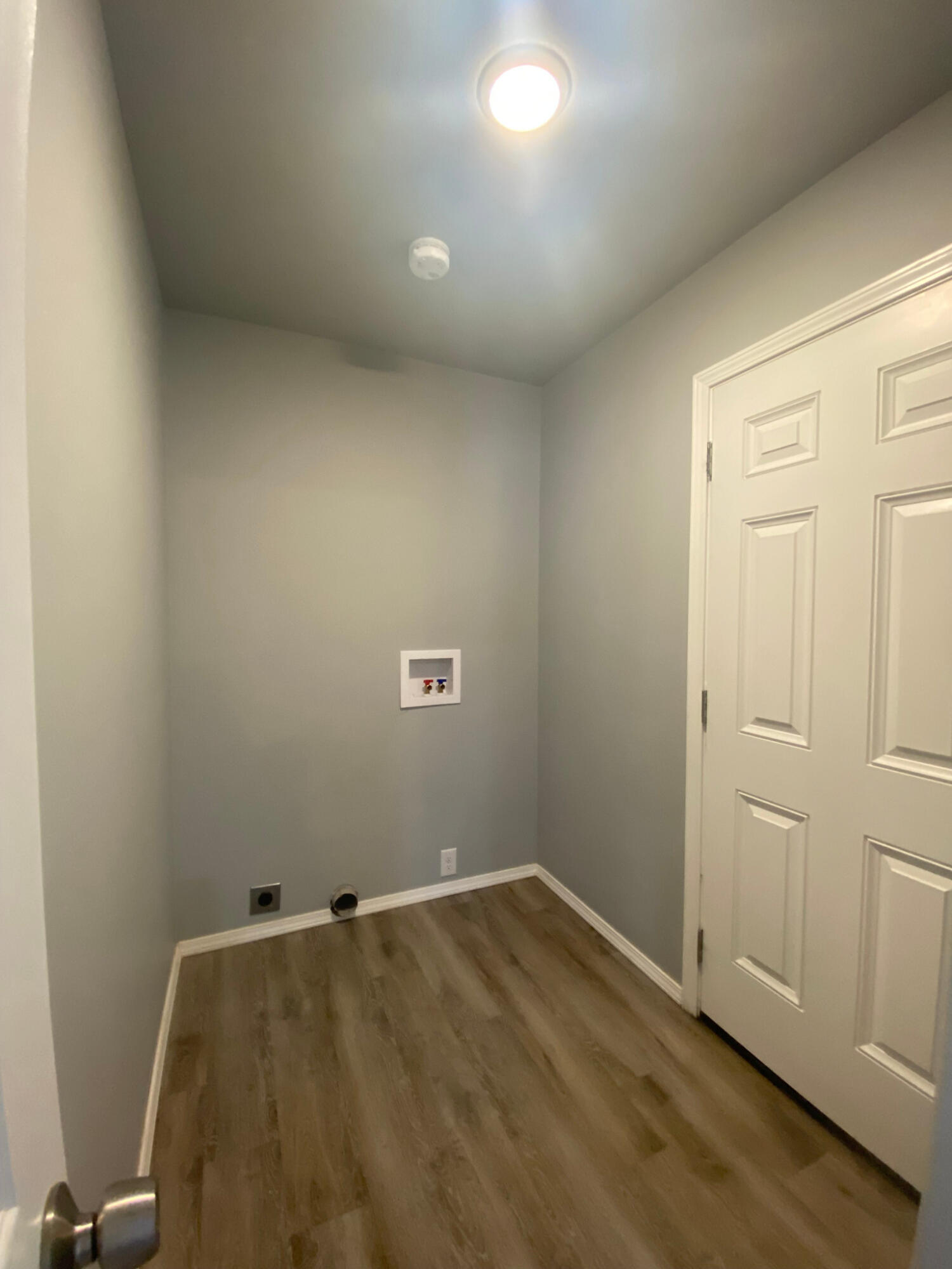8605 10th Place Lubbock, TX 79416 - Photo 5 of 18 an empty room with wooden floor