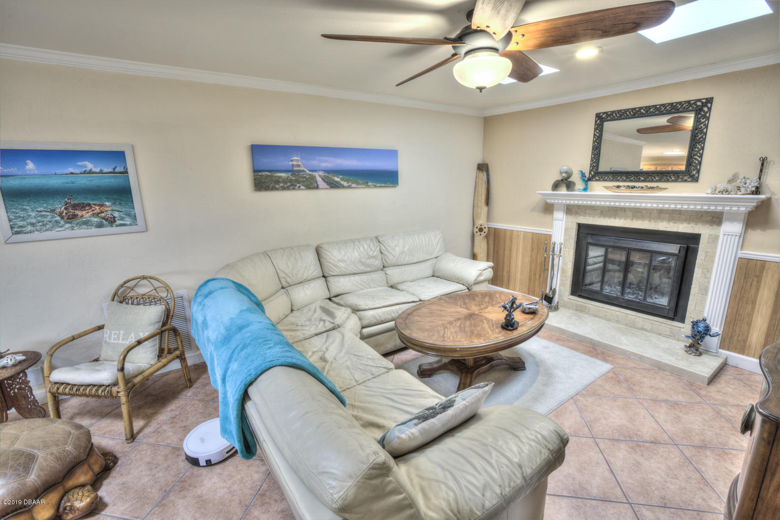 102 Marie Drive Ponce Inlet, FL 32127 - Photo 11 of 32 a living room with furniture and a fireplace