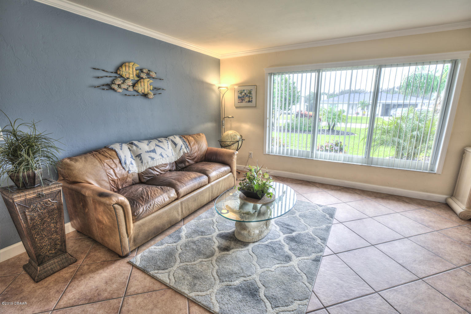 102 Marie Drive Ponce Inlet, FL 32127 - Photo 15 of 32 a living room with furniture and a potted plant