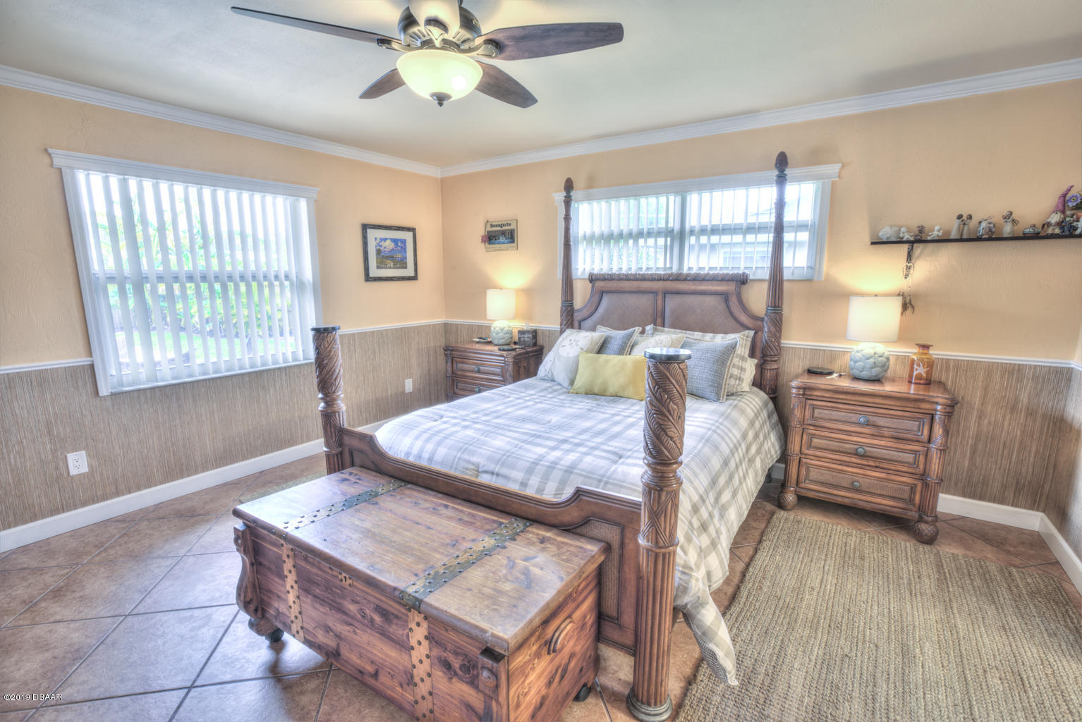 102 Marie Drive Ponce Inlet, FL 32127 - Photo 17 of 32 a living room with furniture a large window and wooden floor