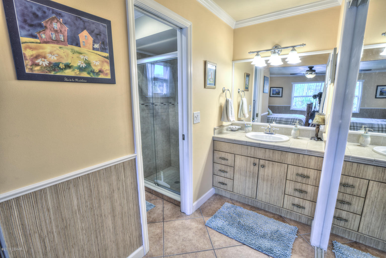 102 Marie Drive Ponce Inlet, FL 32127 - Photo 19 of 32 a bathroom with a sink and a mirror
