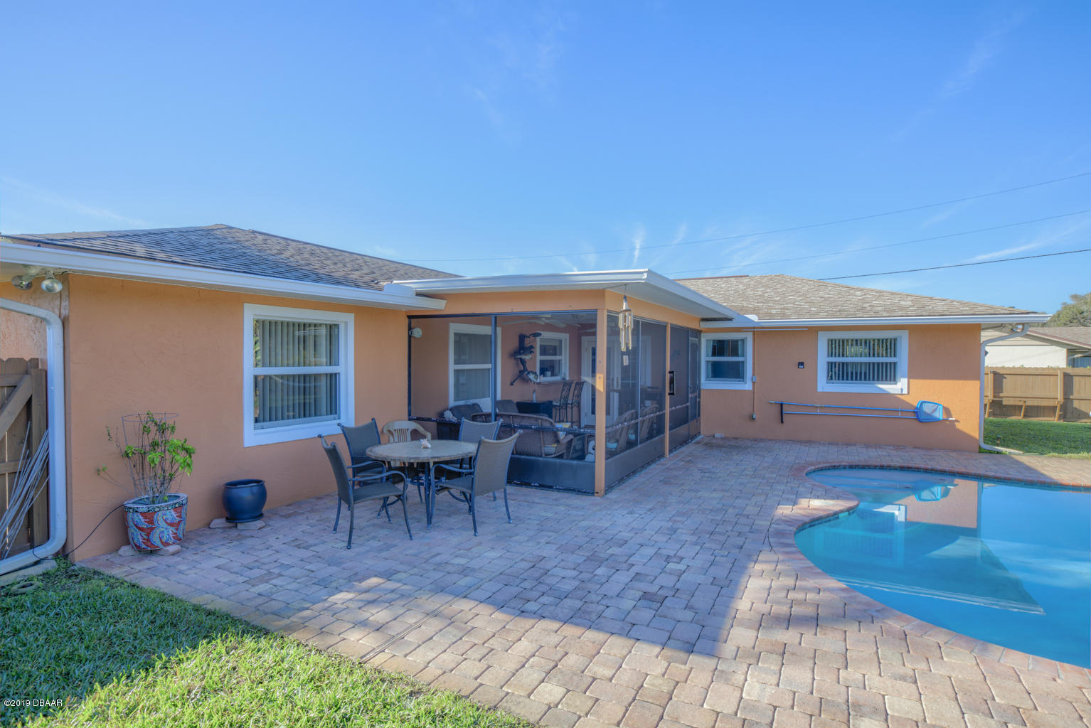 102 Marie Drive Ponce Inlet, FL 32127 - Photo 27 of 32 a view of a house with backyard porch and sitting area