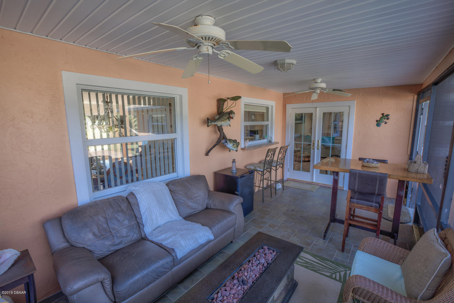 102 Marie Drive Ponce Inlet, FL 32127 - Photo 28 of 32 a living room with furniture a ceiling fan and a window
