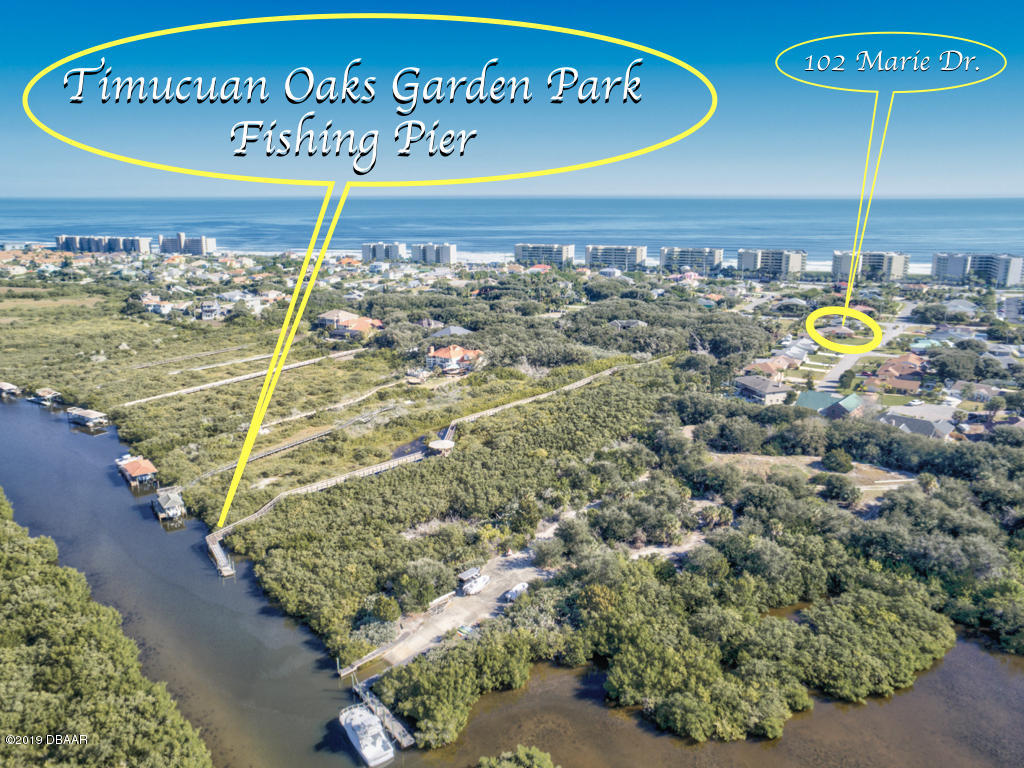 102 Marie Drive Ponce Inlet, FL 32127 - Photo 4 of 32 a view of a swimming pool with an outdoor seating