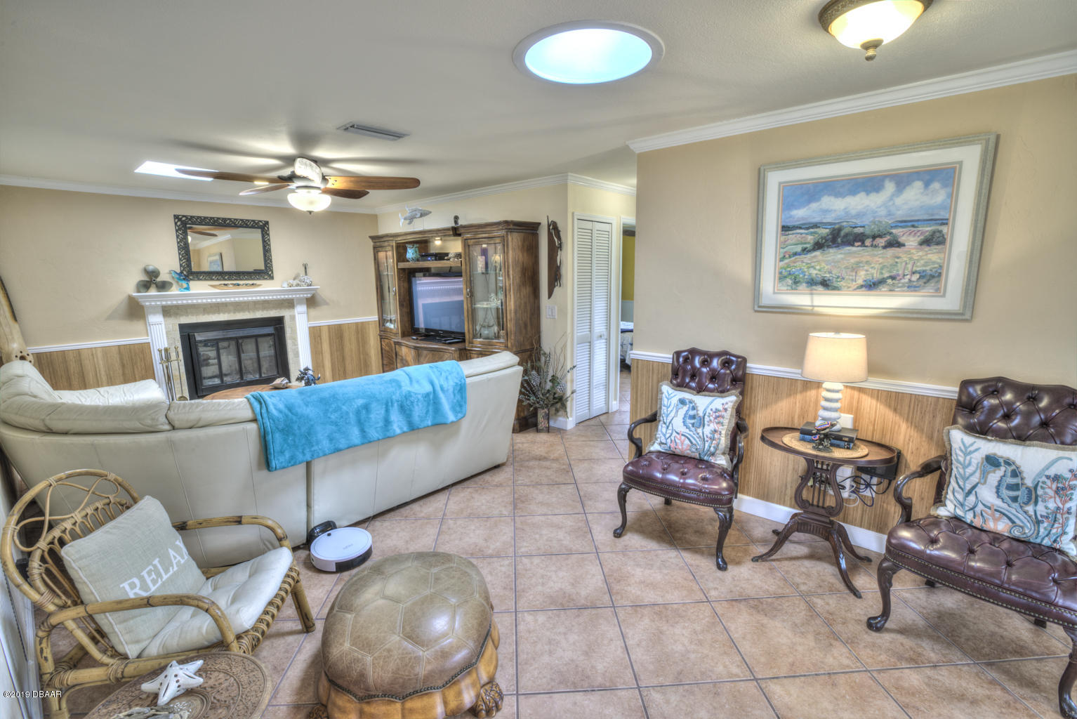 102 Marie Drive Ponce Inlet, FL 32127 - Photo 8 of 32 a living room with furniture and a fireplace