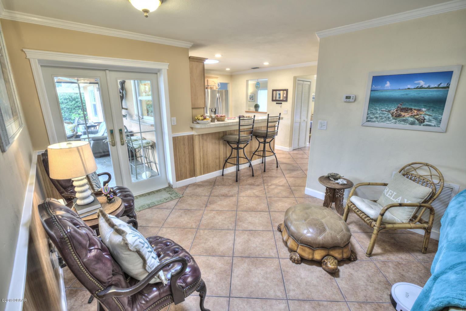 102 Marie Drive Ponce Inlet, FL 32127 - Photo 9 of 32 a living room with furniture and a table