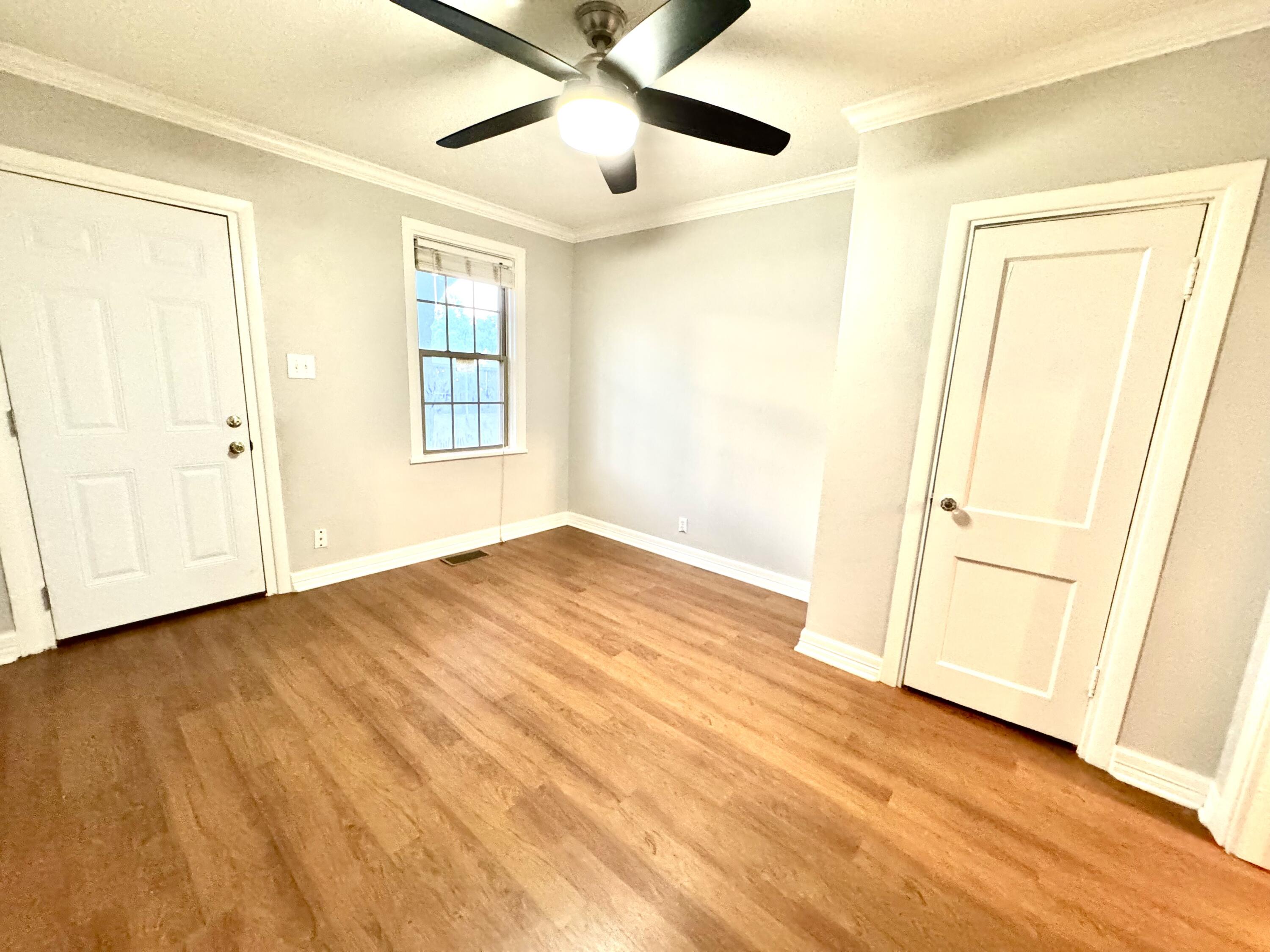 2702 23rd Street, Unit FRONT Lubbock, TX 79410 - Photo 14 of 22 a view of empty room with wooden floor