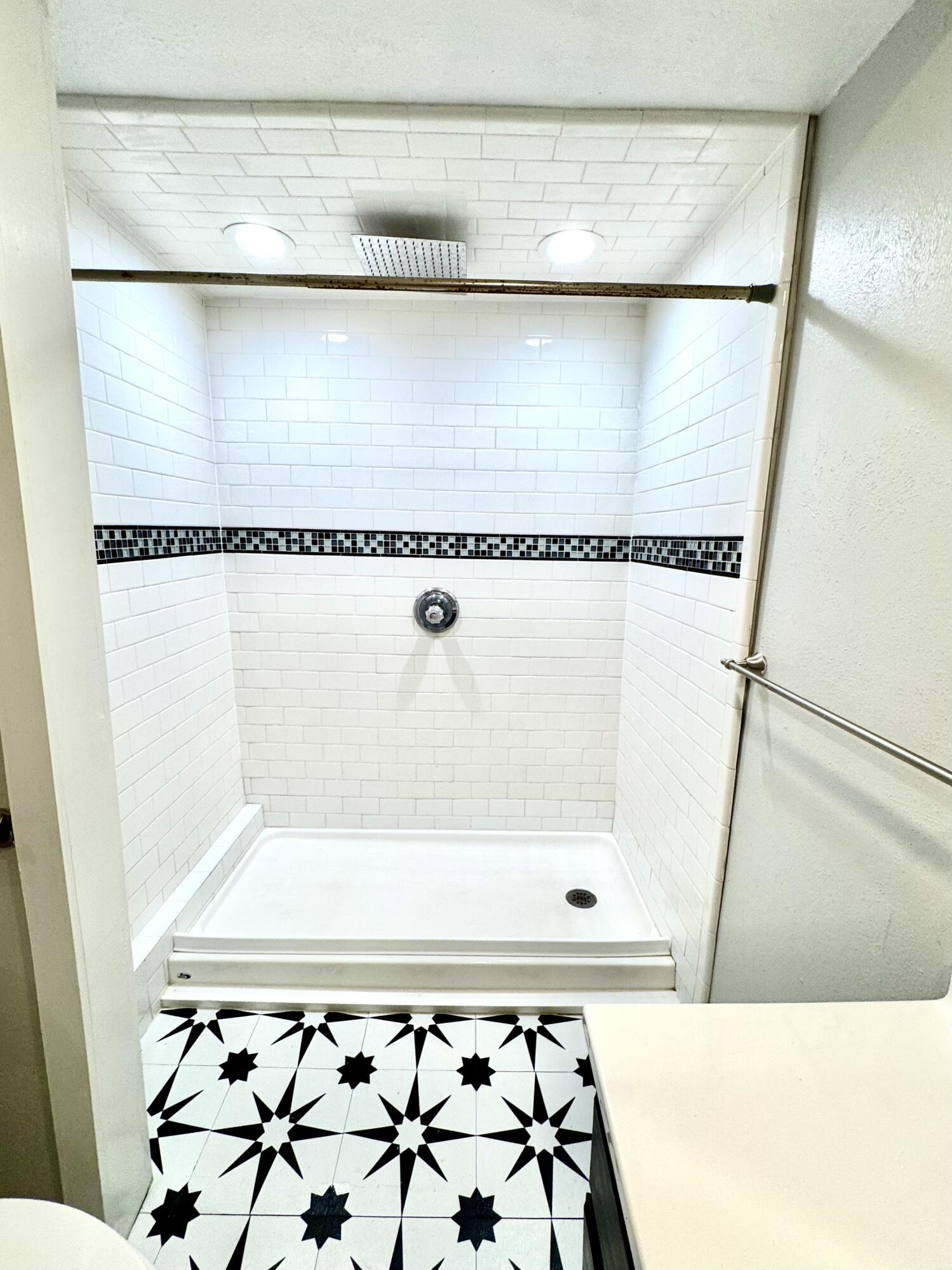 2702 23rd Street, Unit FRONT Lubbock, TX 79410 - Photo 18 of 22 a bathroom with a bath tub