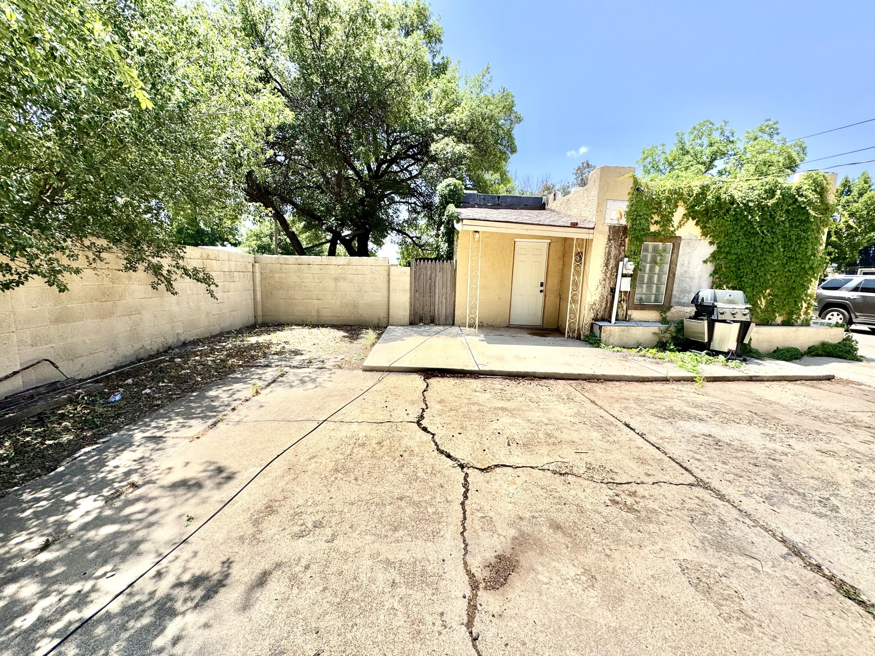 2702 23rd Street, Unit FRONT Lubbock, TX 79410 - Photo 21 of 22 a view of a backyard of the house
