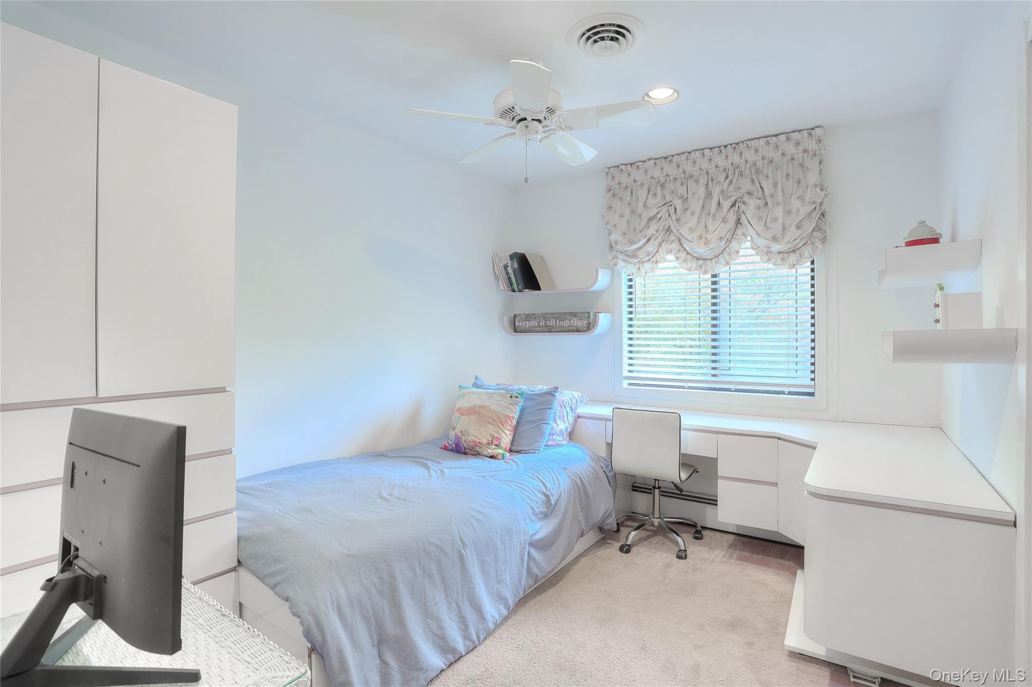 47 Camp Hill Road Pomona, NY 10970 - Photo 14 of 30 a bedroom with a bed and a chair
