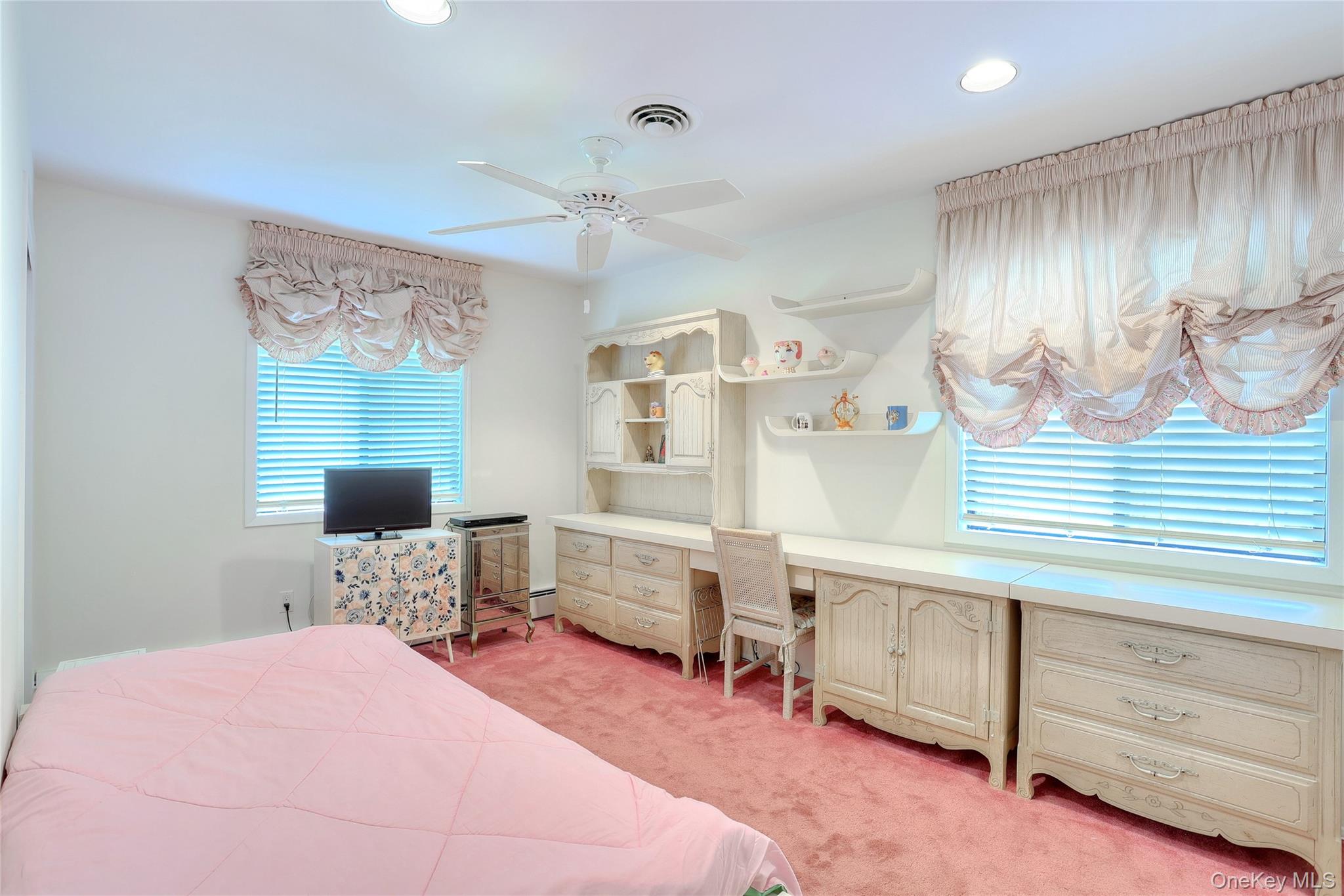 47 Camp Hill Road Pomona, NY 10970 - Photo 15 of 30 a bedroom with furniture and a flat screen tv