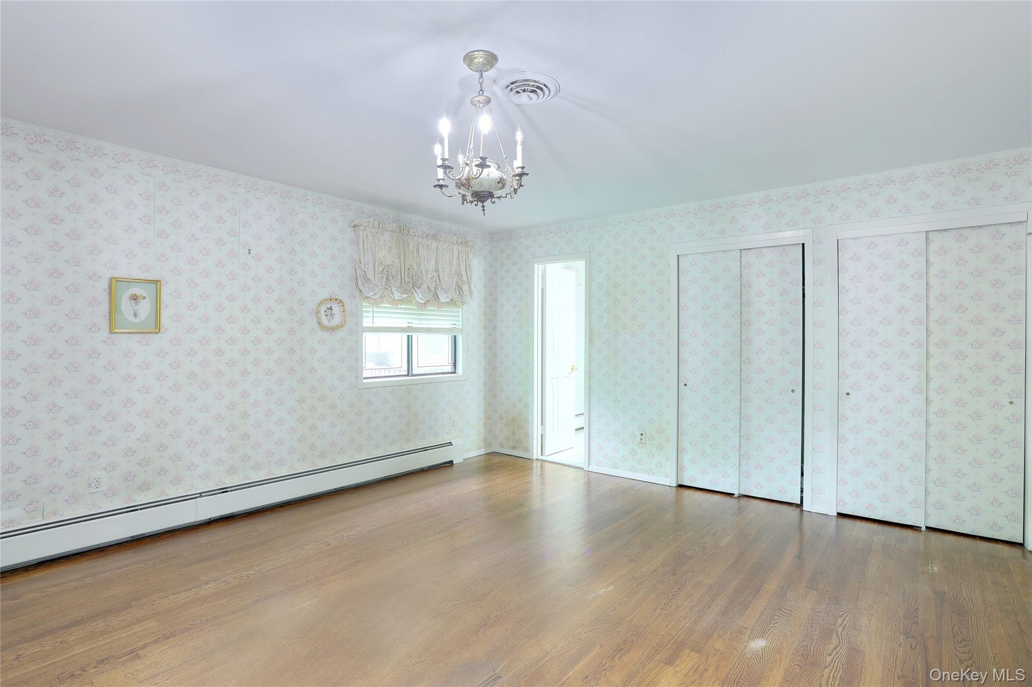 47 Camp Hill Road Pomona, NY 10970 - Photo 18 of 30 a view of an empty room with wooden floor and a window