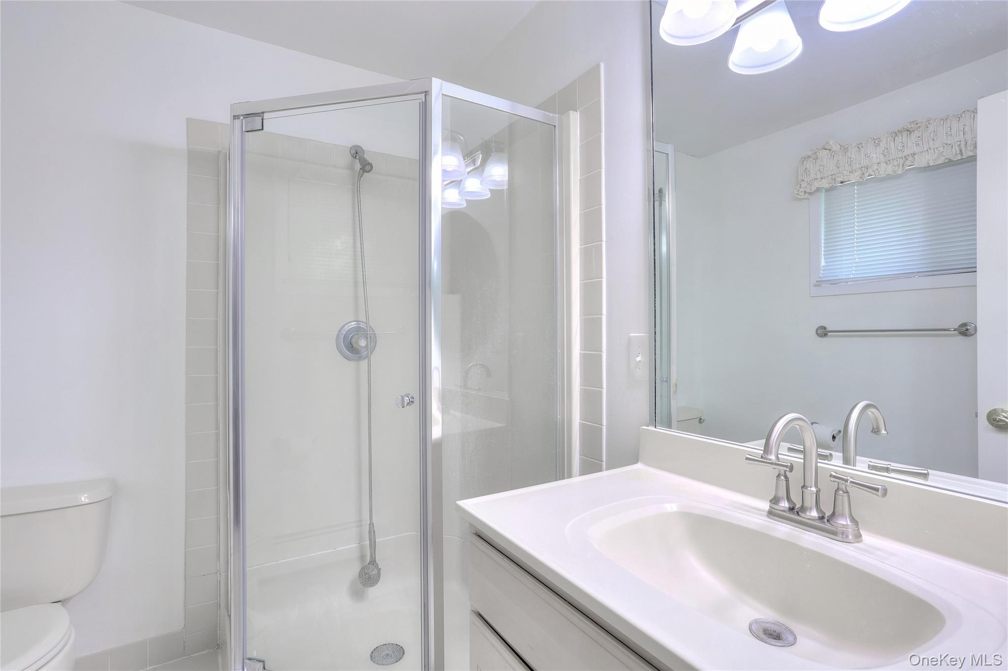 47 Camp Hill Road Pomona, NY 10970 - Photo 19 of 30 a bathroom with a sink toilet and shower