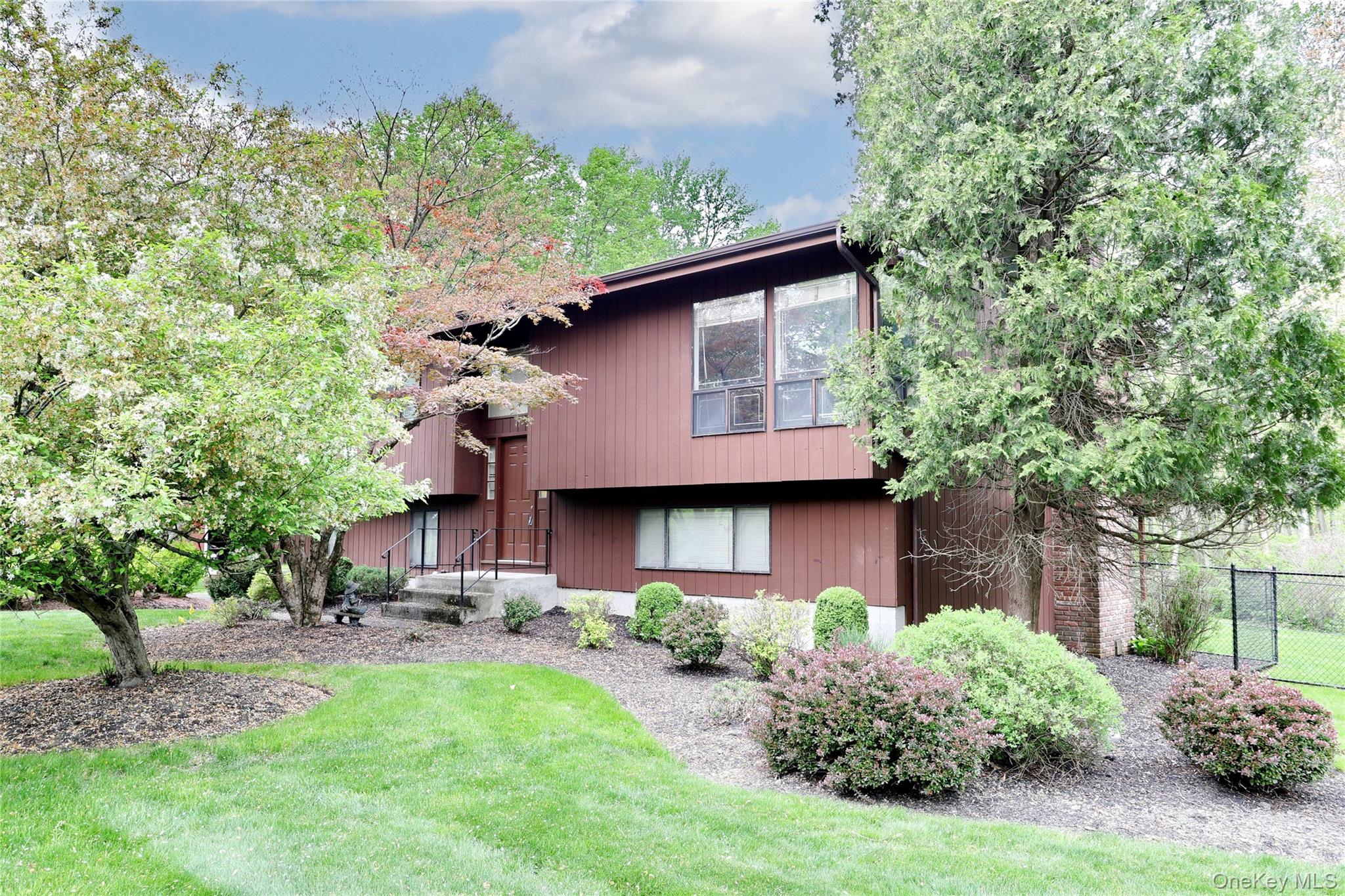 47 Camp Hill Road Pomona, NY 10970 - Photo 2 of 30 a front view of a house with garden