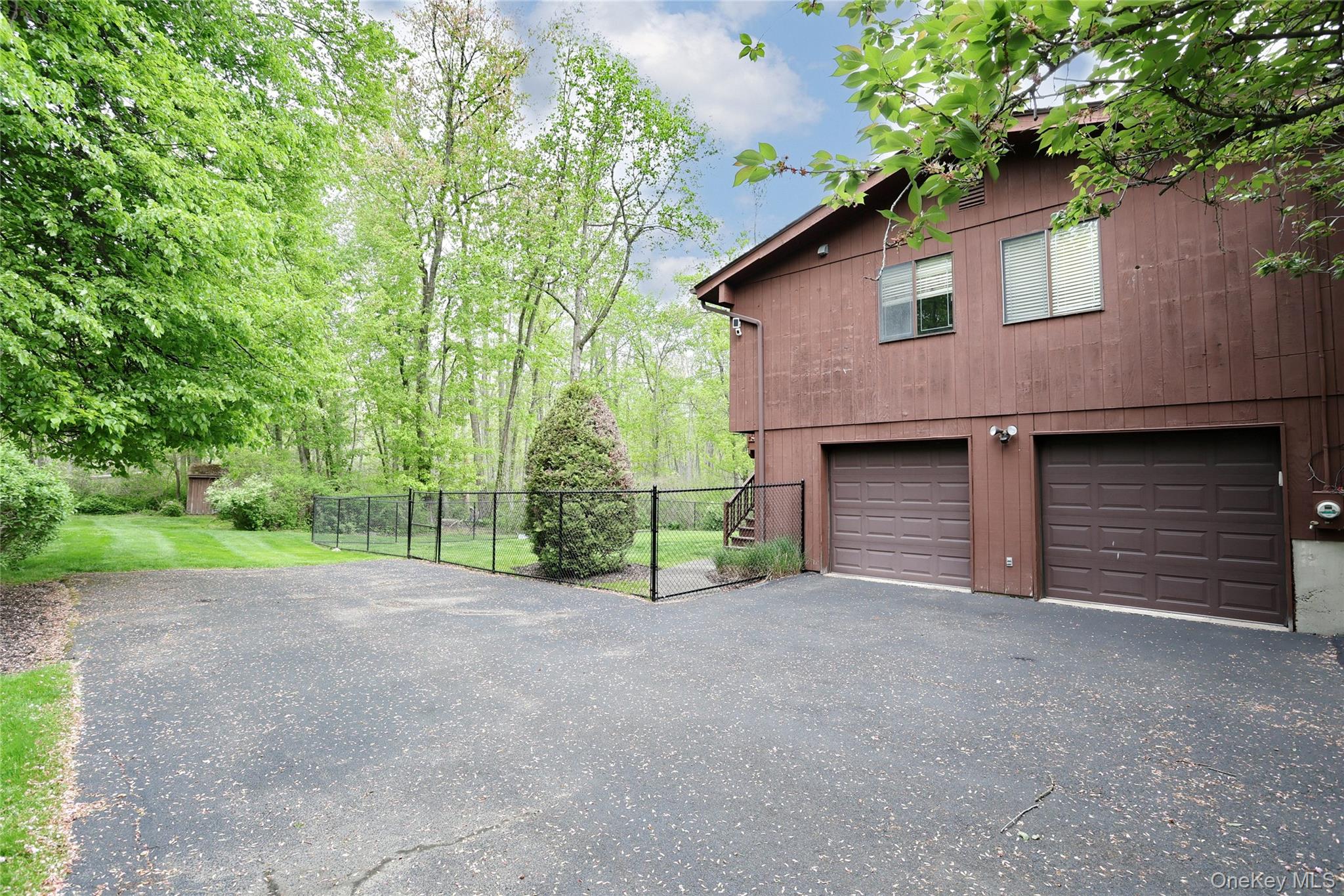 47 Camp Hill Road Pomona, NY 10970 - Photo 24 of 30 a view of a house with a yard and garage