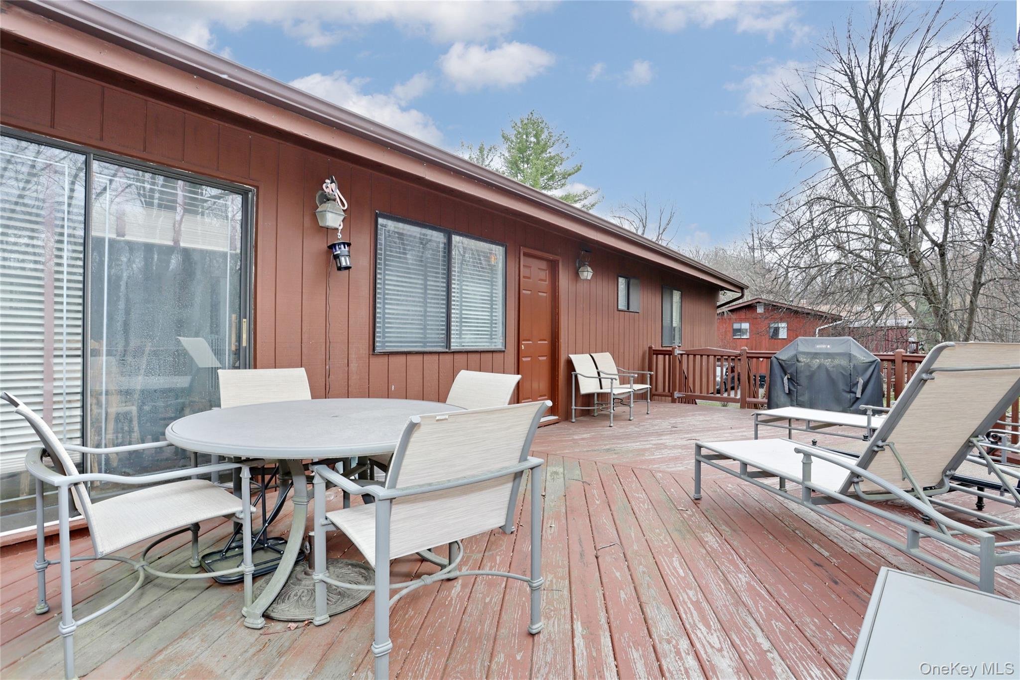 47 Camp Hill Road Pomona, NY 10970 - Photo 30 of 30 a view of a patio with furniture and wooden floor