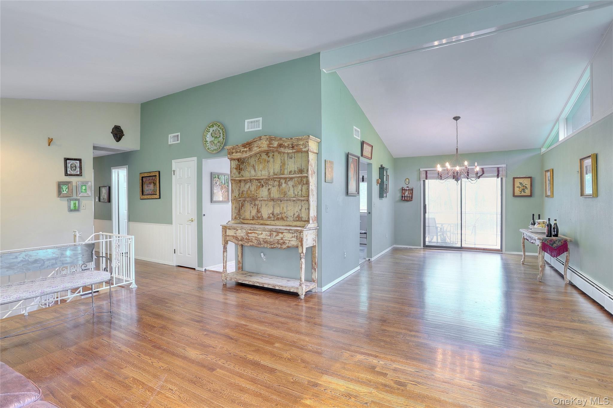 47 Camp Hill Road Pomona, NY 10970 - Photo 7 of 30 a living room with furniture and a chandelier