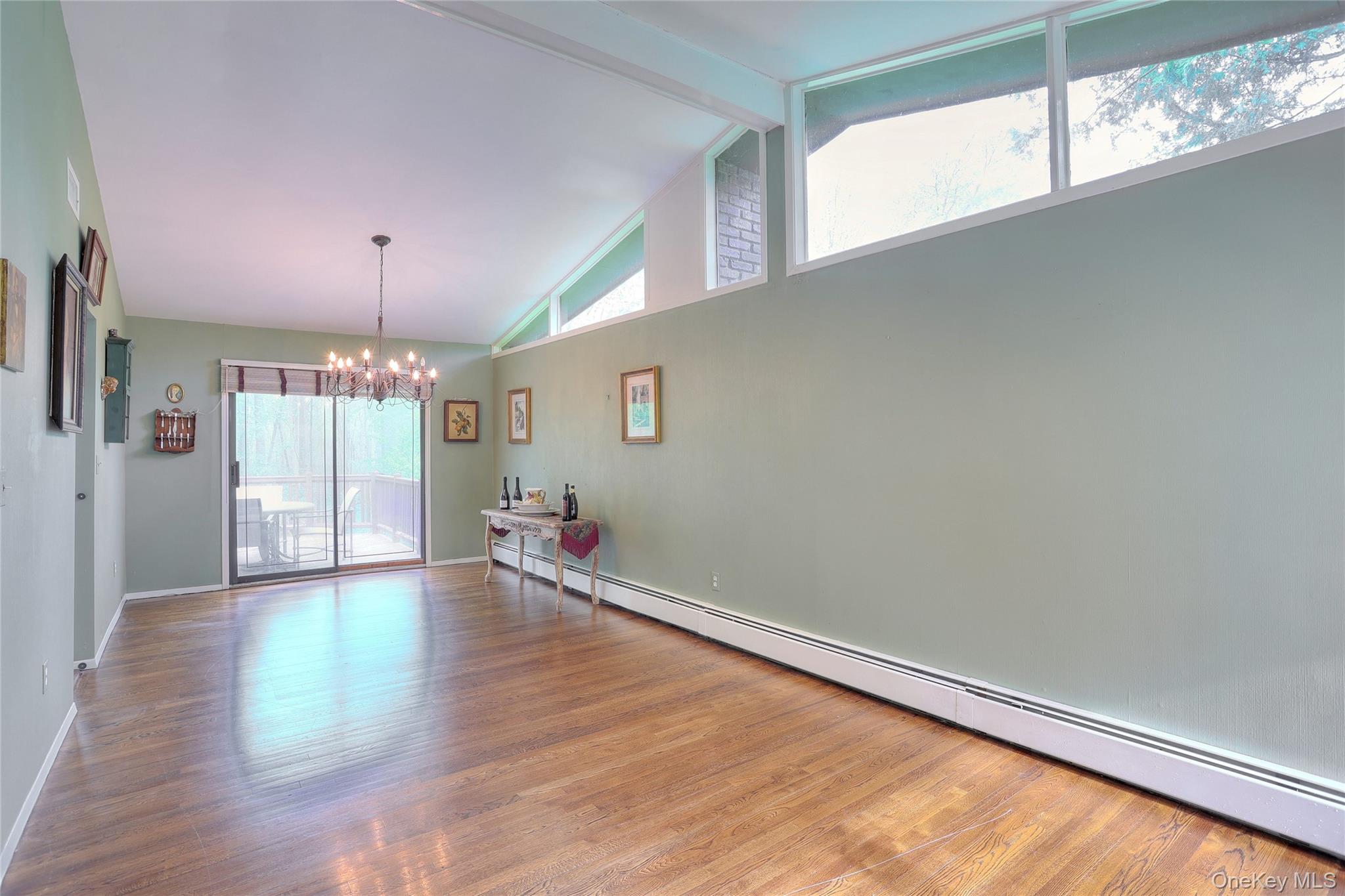 47 Camp Hill Road Pomona, NY 10970 - Photo 8 of 30 a view of an empty room with wooden floor and a window
