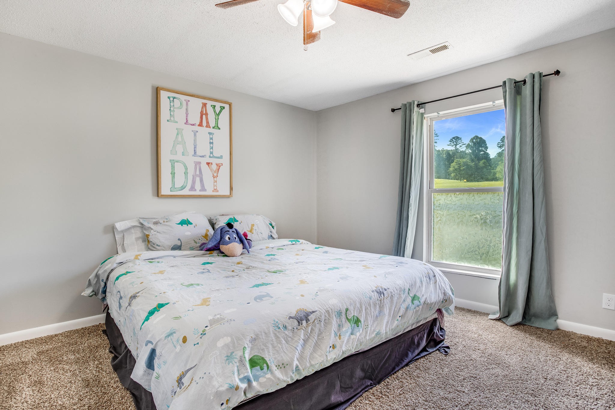 693 Robertsville Road Oak Ridge, TN 37830 - Photo 14 of 22 a bedroom with a bed and a window