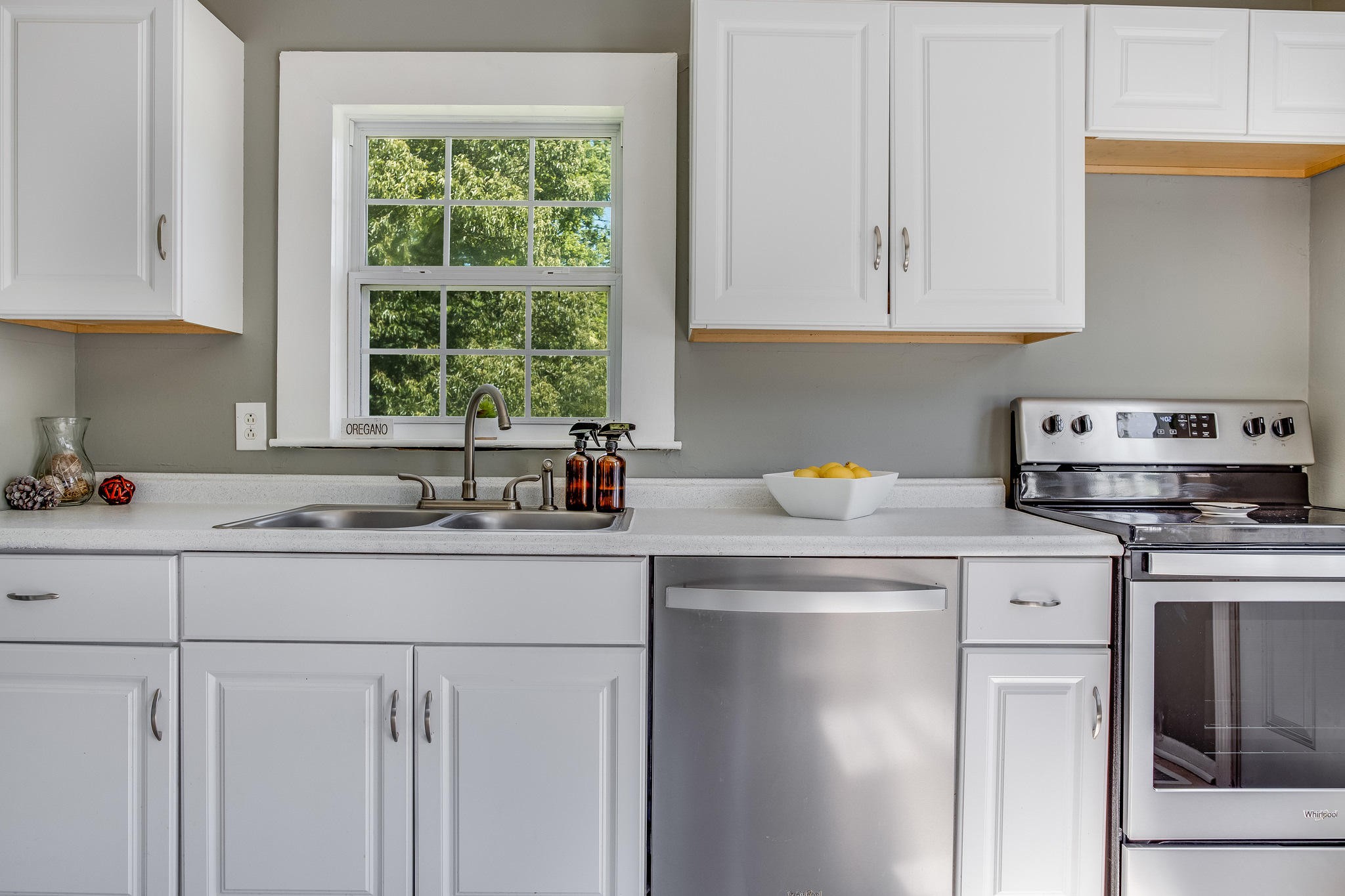 693 Robertsville Road Oak Ridge, TN 37830 - Photo 8 of 22 a kitchen with stainless steel appliances granite countertop a sink a stove and a microwave