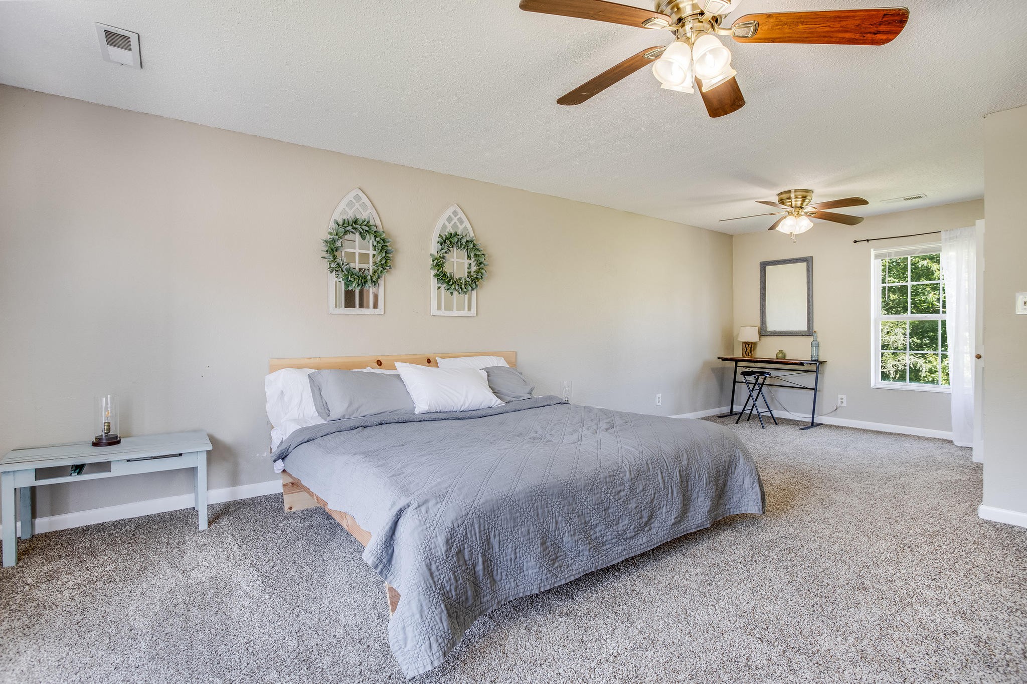 693 Robertsville Road Oak Ridge, TN 37830 - Photo 10 of 22 a bedroom with a bed and a chandelier