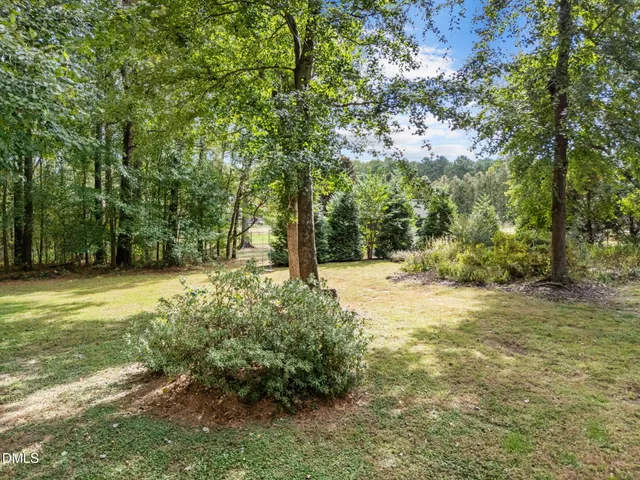 a view of outdoor space with deck and yard