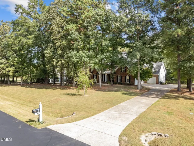 a view of a swimming pool with an outdoor space and seating area
