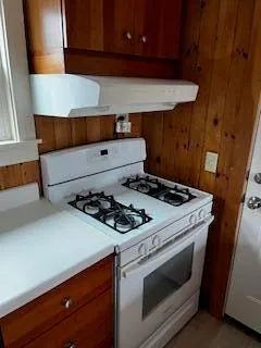 a kitchen with a refrigerator and a sink