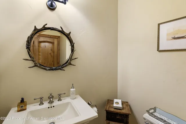 a bathroom with a sink and mirror