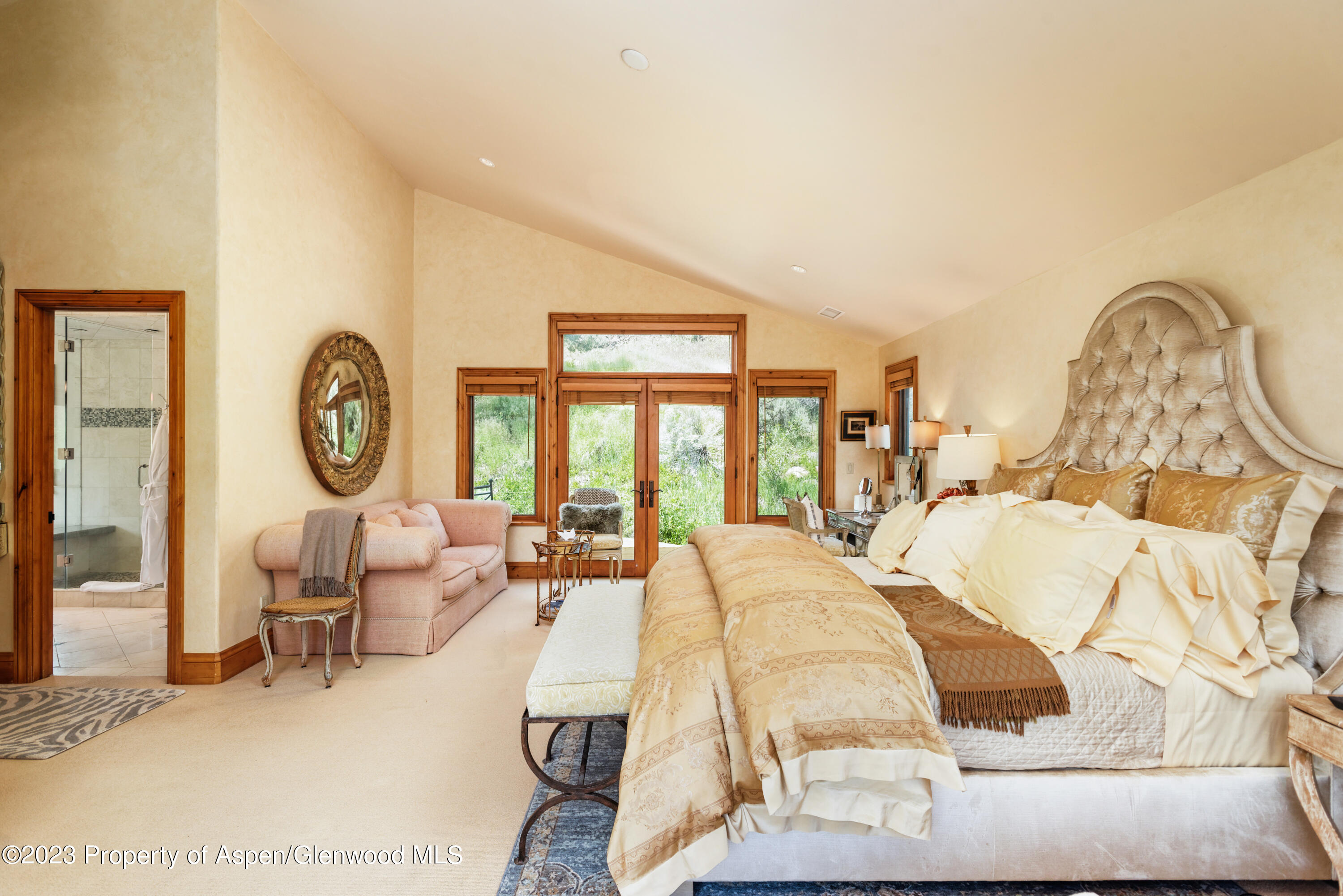 121 Ridge Road Basalt, CO 81621 - Photo 13 of 25 a bed room with a bed mirror and a large window