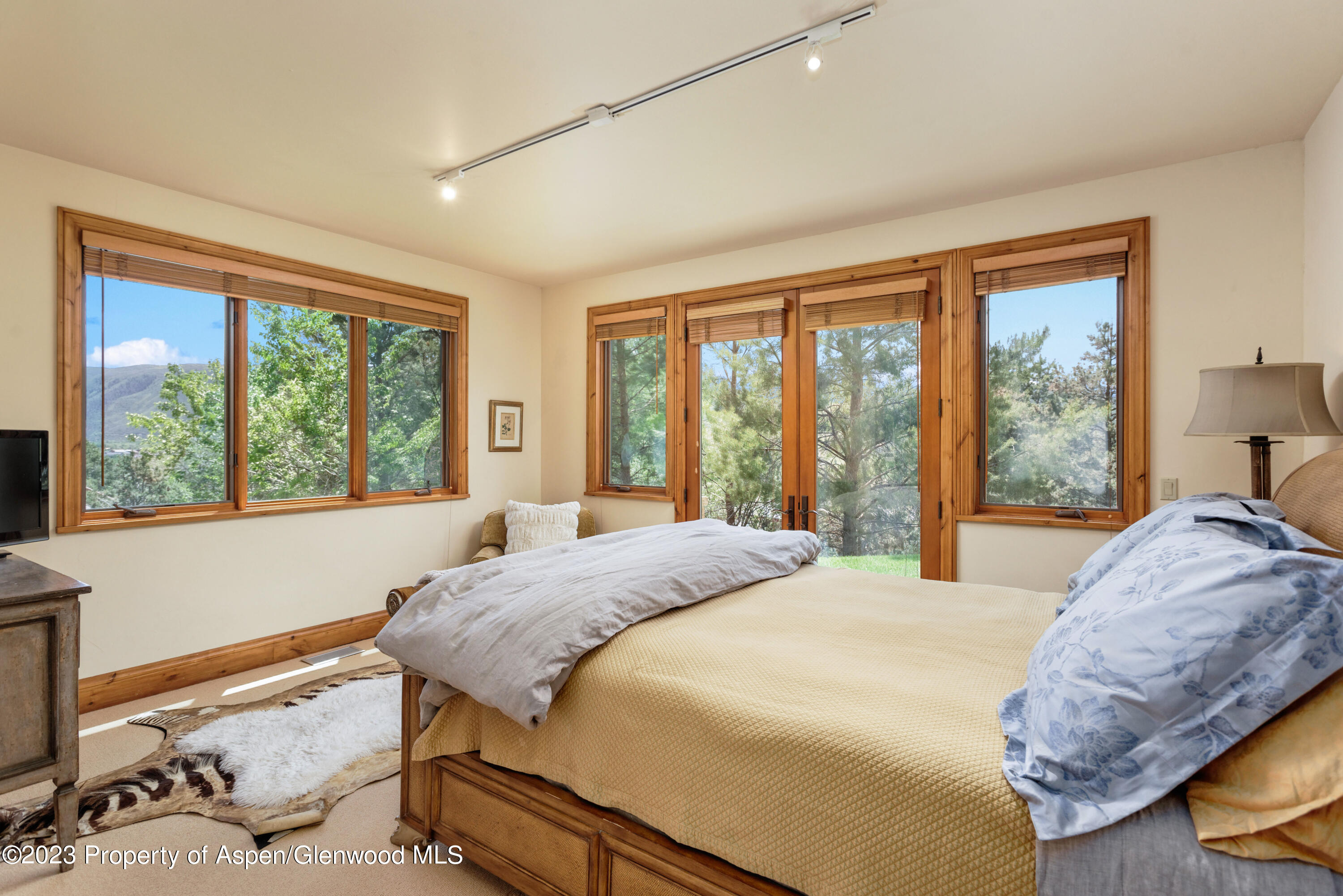 121 Ridge Road Basalt, CO 81621 - Photo 15 of 25 a bedroom with a bed and a large window